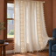 Oatmeal curtain with crochet inserts in a living room