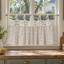 Brown gingham cafe curtain with lace header in a kitchen window