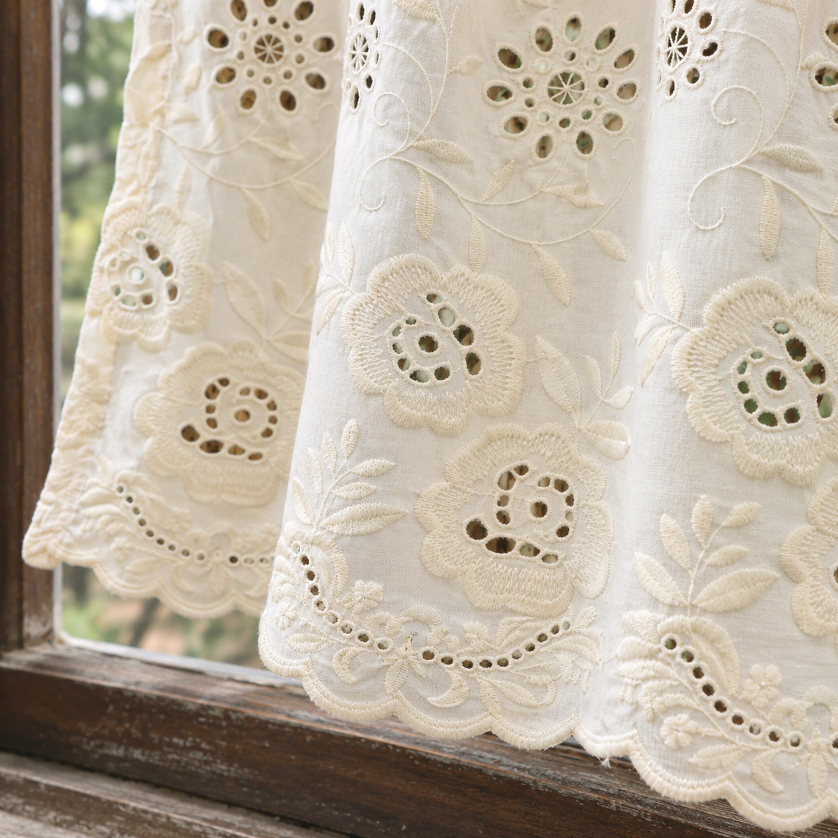 Ivory cutwork floral short curtain — hem view